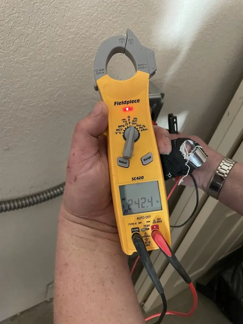 Voltage testing with clamp meter during Recessed Lighting Installation in Tillmans Corner